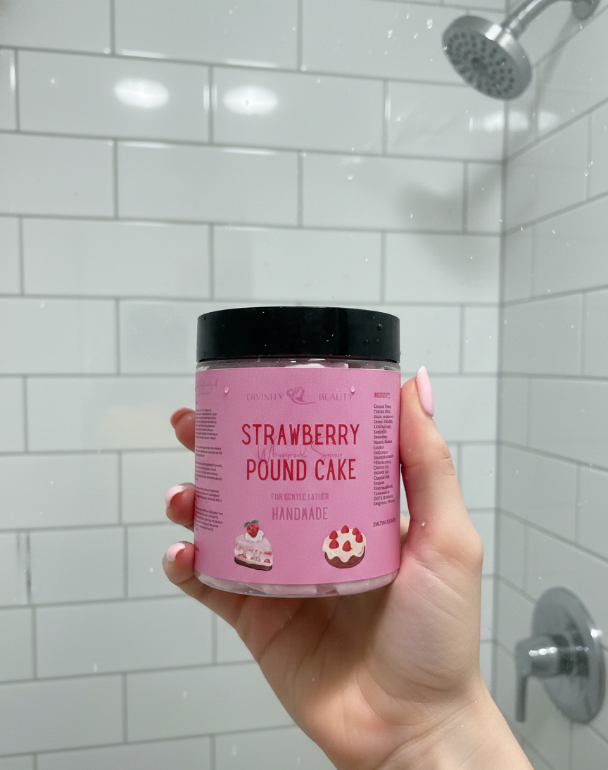 Hand holding a pink container labeled 'Strawberry Pound Cake' in a bathroom setting.